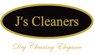 Logo for J's Cleaners, featuring gold text on a black oval background with a gold border; tagline below reads "Dry Cleaning Experts" in script font.